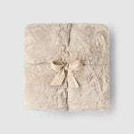a square blanket with a bow