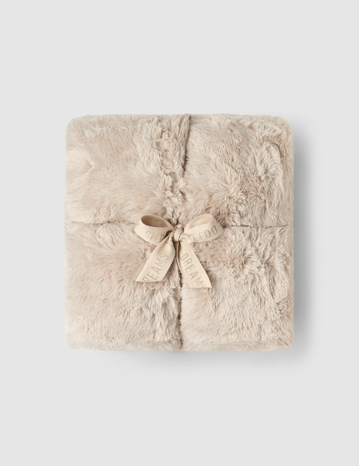 a square blanket with a bow
