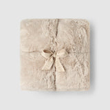 a square blanket with a bow