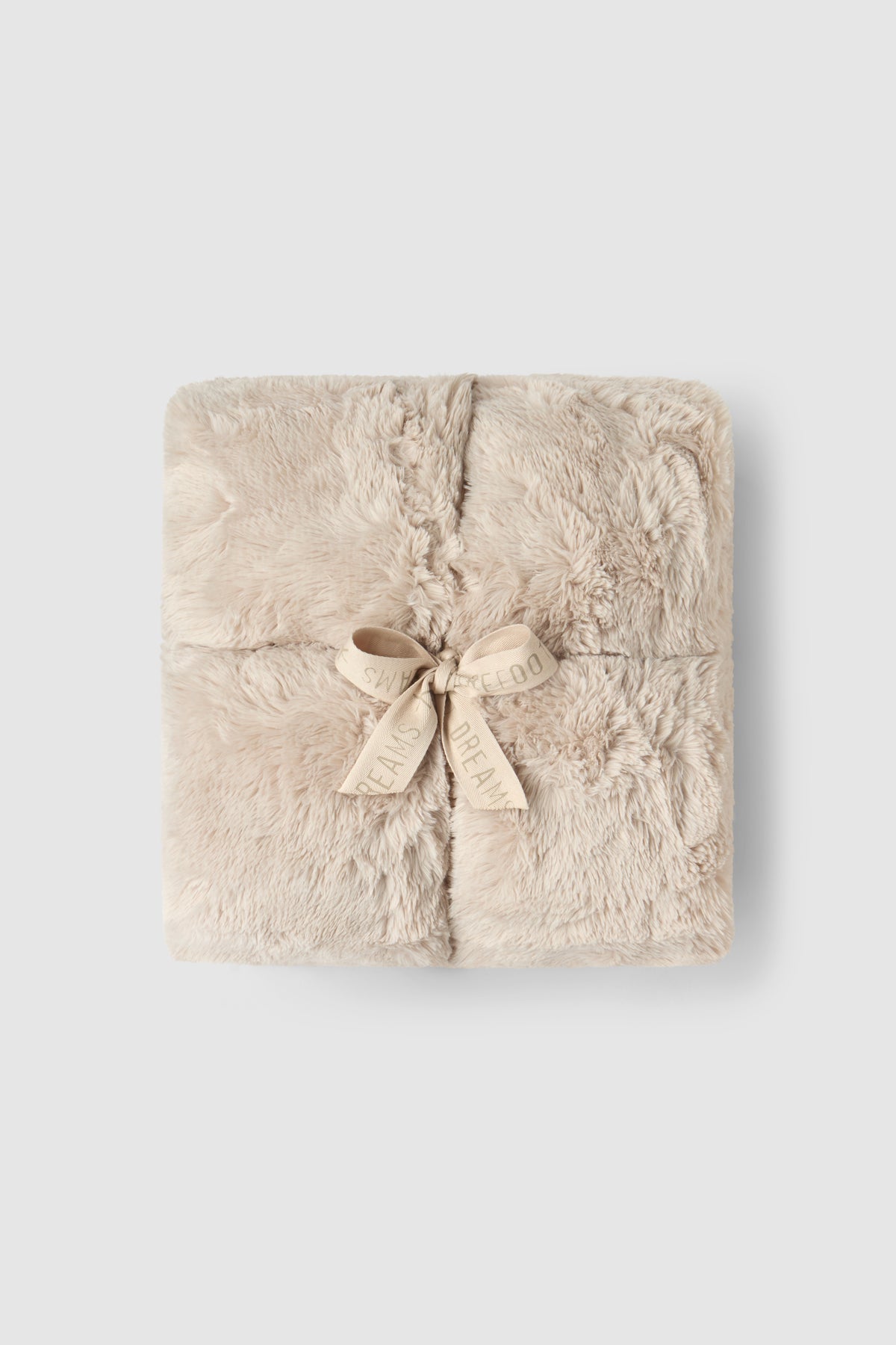a square blanket with a bow