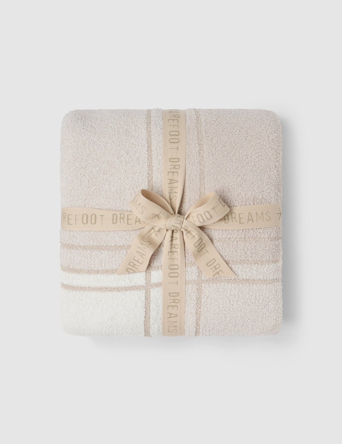 a white towel wrapped in a ribbon