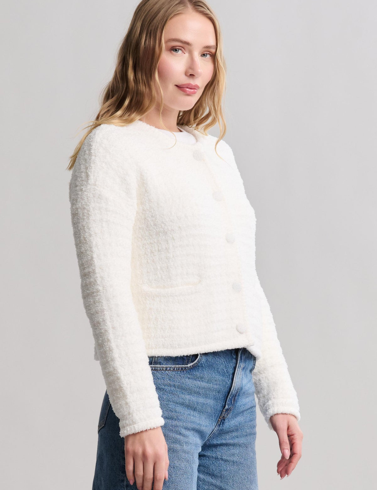 a woman in a white sweater
