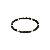 a black and gold beaded bracelet