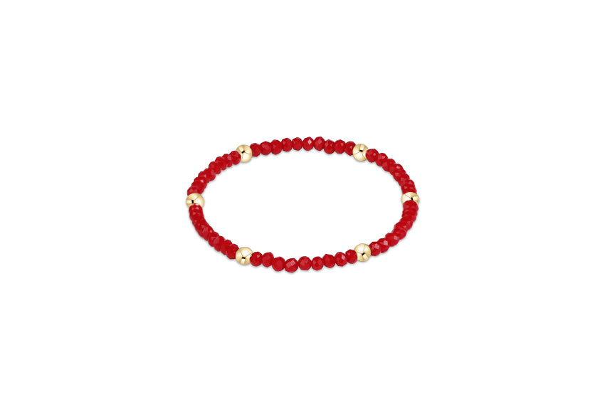 a red and gold beaded bracelet
