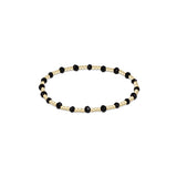 a black and gold beaded bracelet