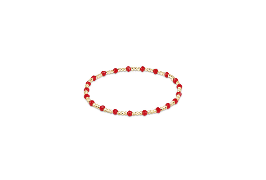 a red and gold beaded bracelet