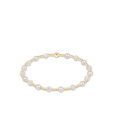 a bracelet with pearls on it