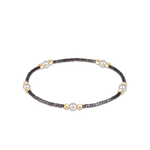 a bracelet with pearls on it