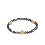 a bracelet with a cross on it