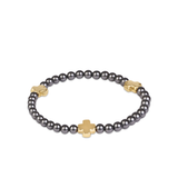 a bracelet with a cross on it