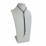 a necklace on a mannequin