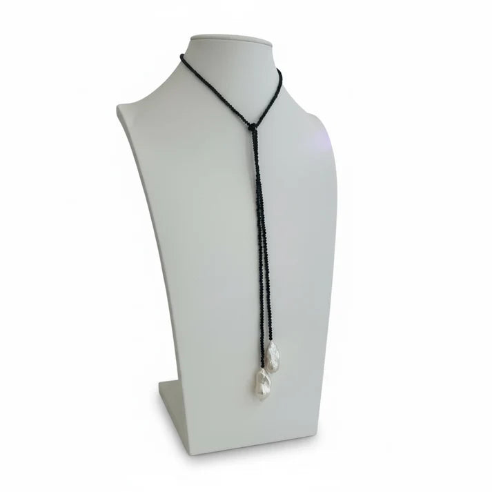 a necklace on a mannequin