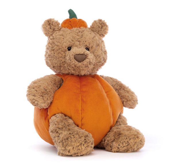 a stuffed animal in a pumpkin