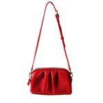 a red purse with a strap