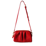 a red purse with a strap