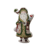 a stuffed santa claus with a red hat and green robe