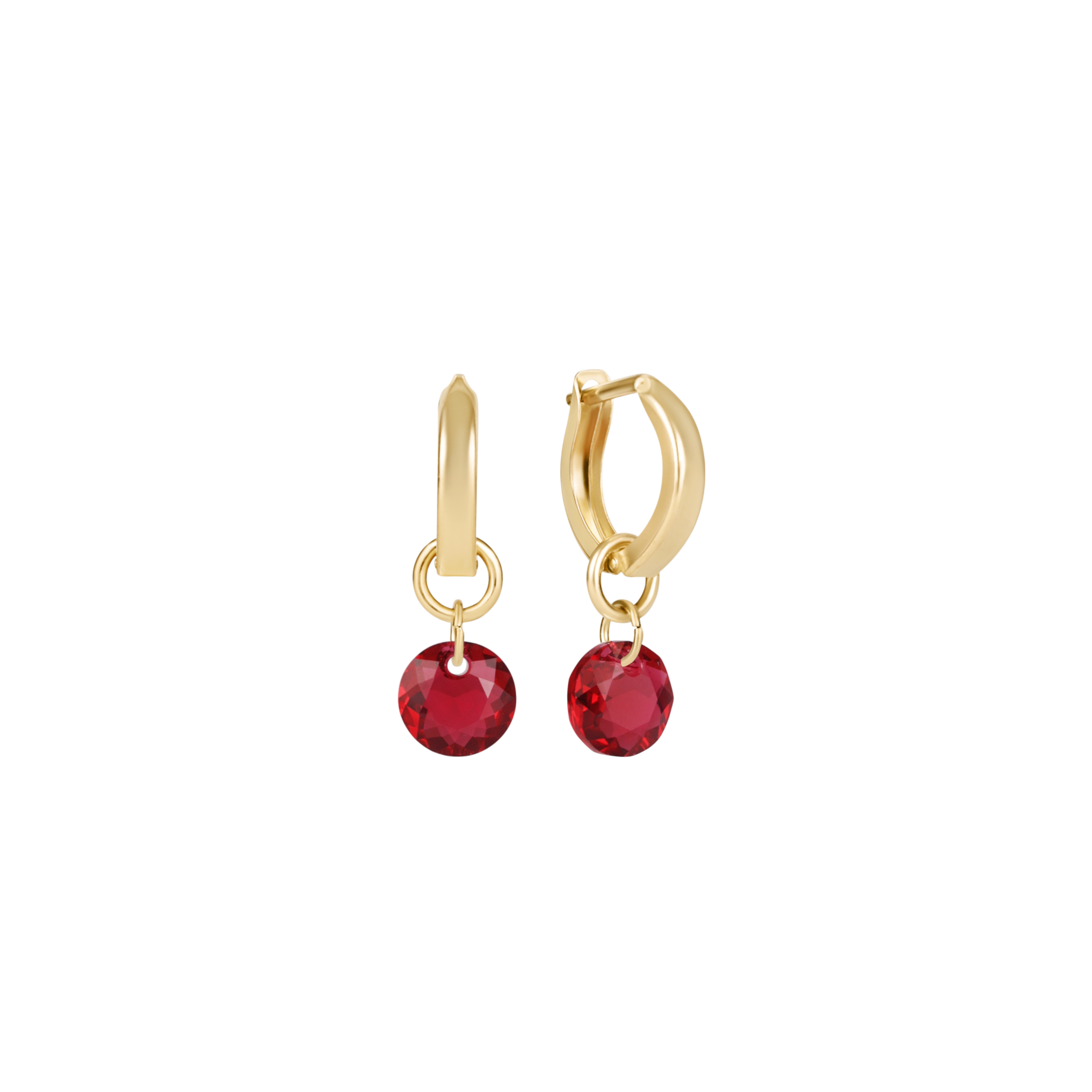 a pair of earrings with red stones