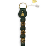 a green leather keychain with bells