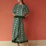a woman in a green dress