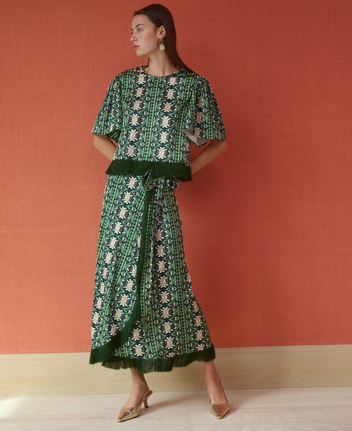 a woman in a green dress
