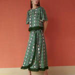 a woman in a green dress