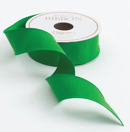 a green ribbon on a spool