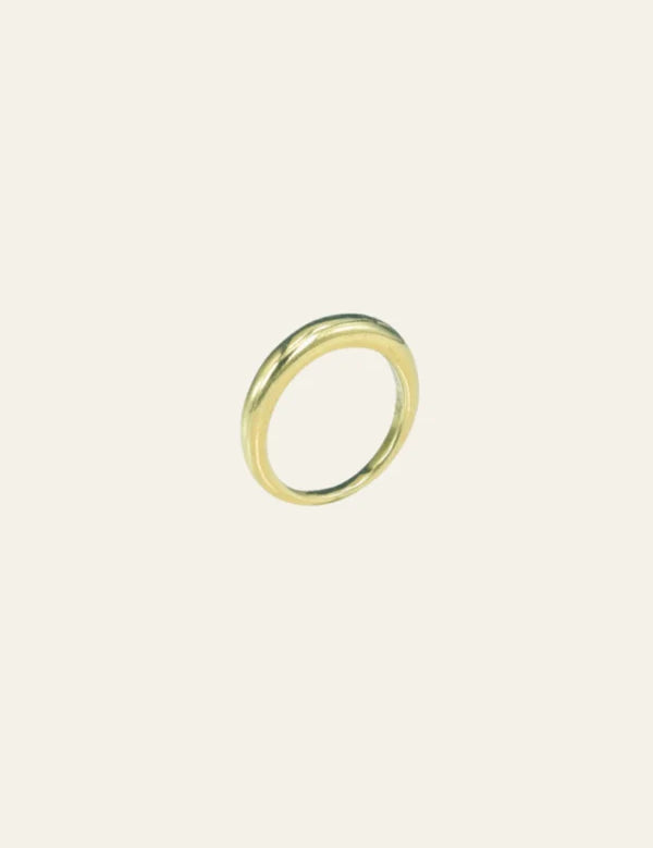 a gold ring on a white background