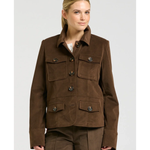 a woman in a brown jacket