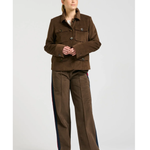 a woman in brown jacket and pants