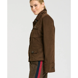 a woman in a brown jacket
