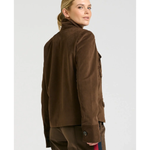 a woman in brown jacket