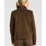 a woman in brown jacket
