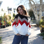 a woman in a sweater