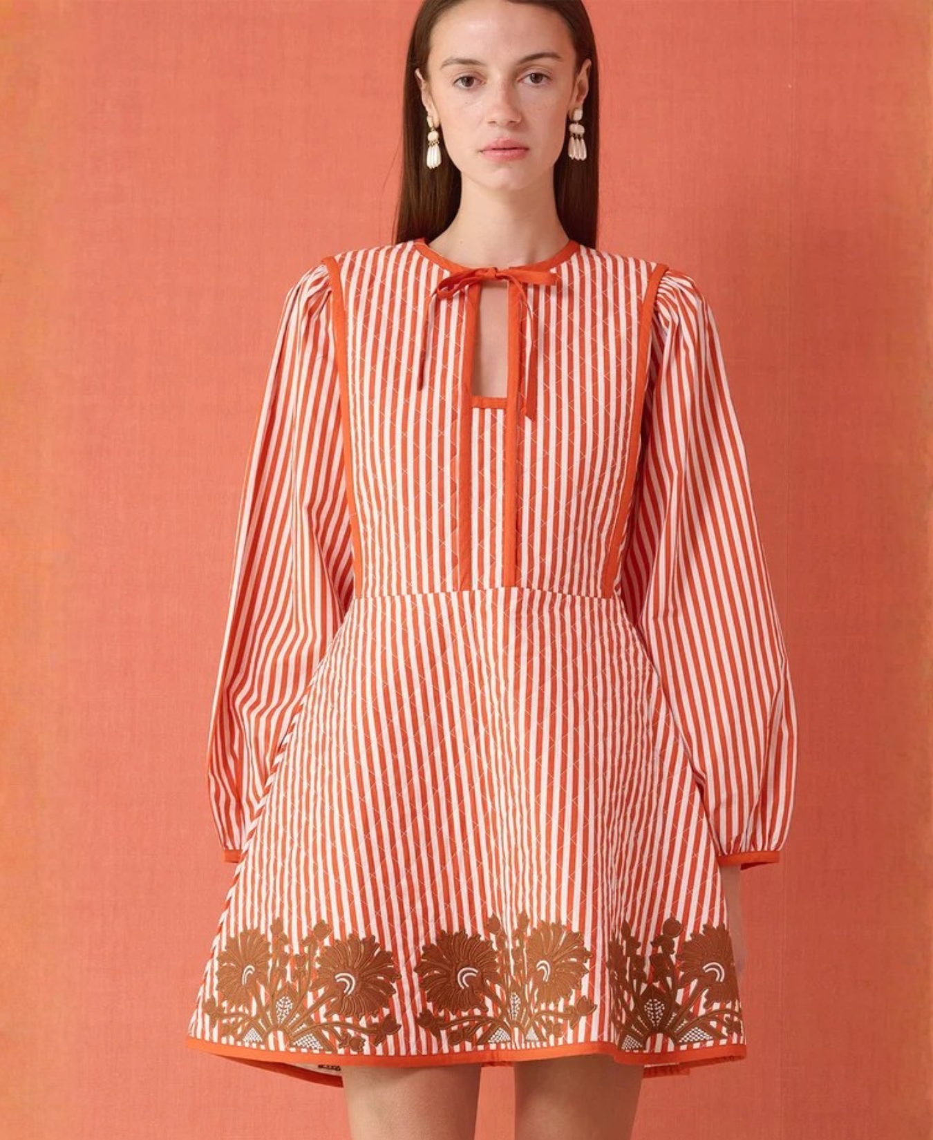 a woman in a striped dress