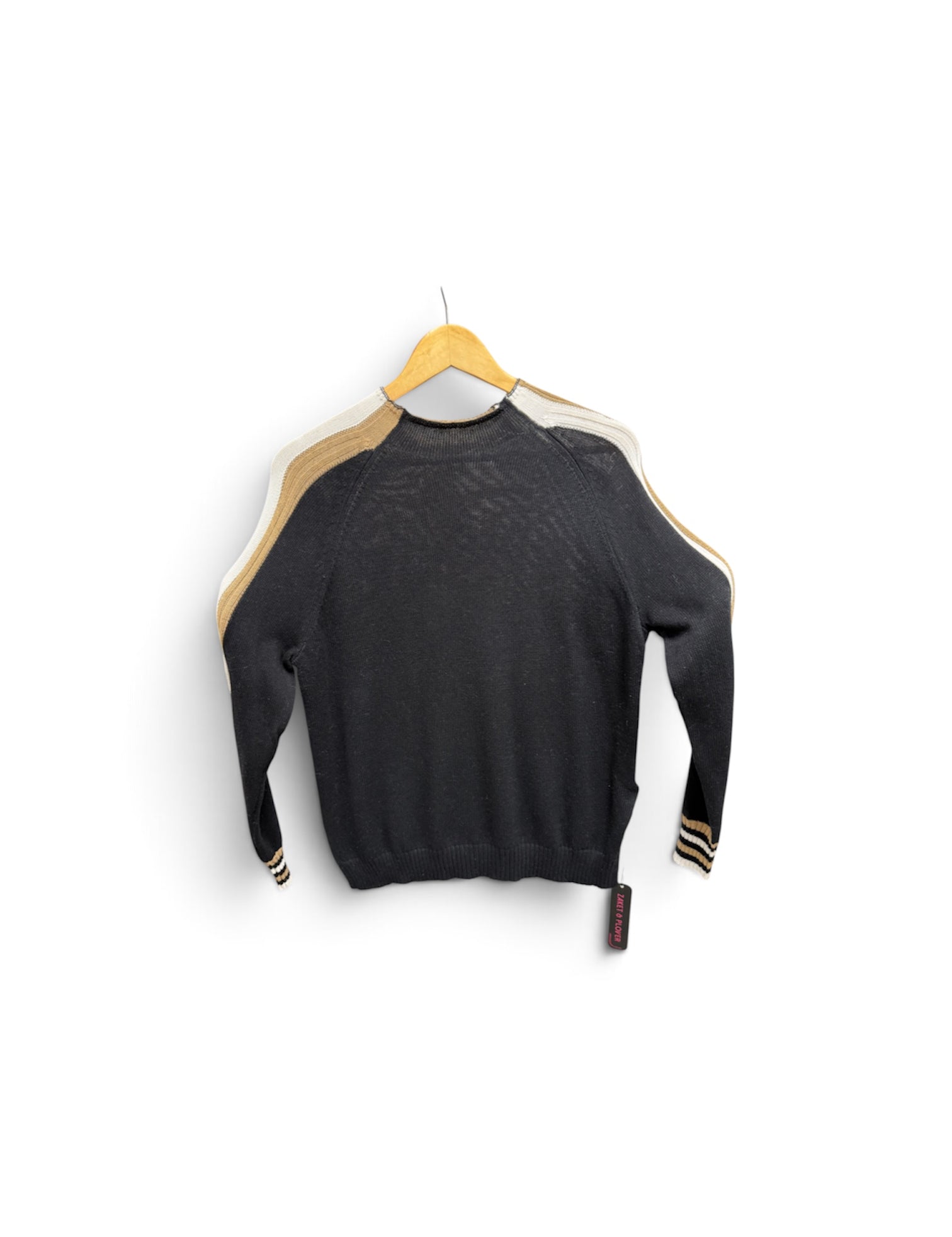 a black sweater with gold stripes on a swinger