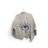 a sweater with a eye on it