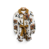 a white and brown floral shirt