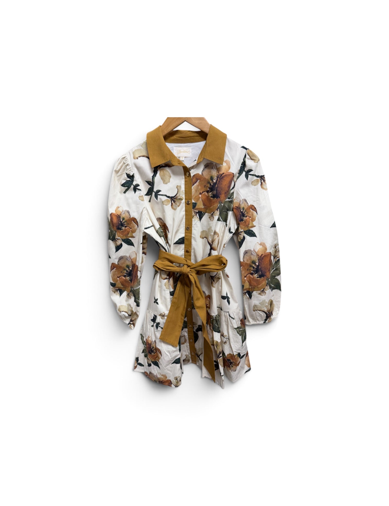 a white and brown floral shirt