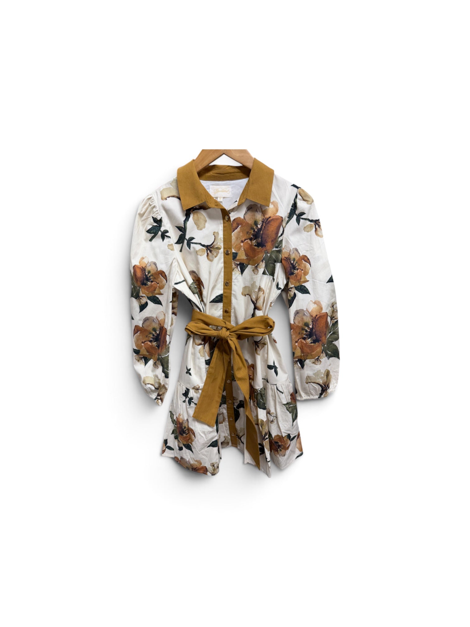 a white and brown floral shirt