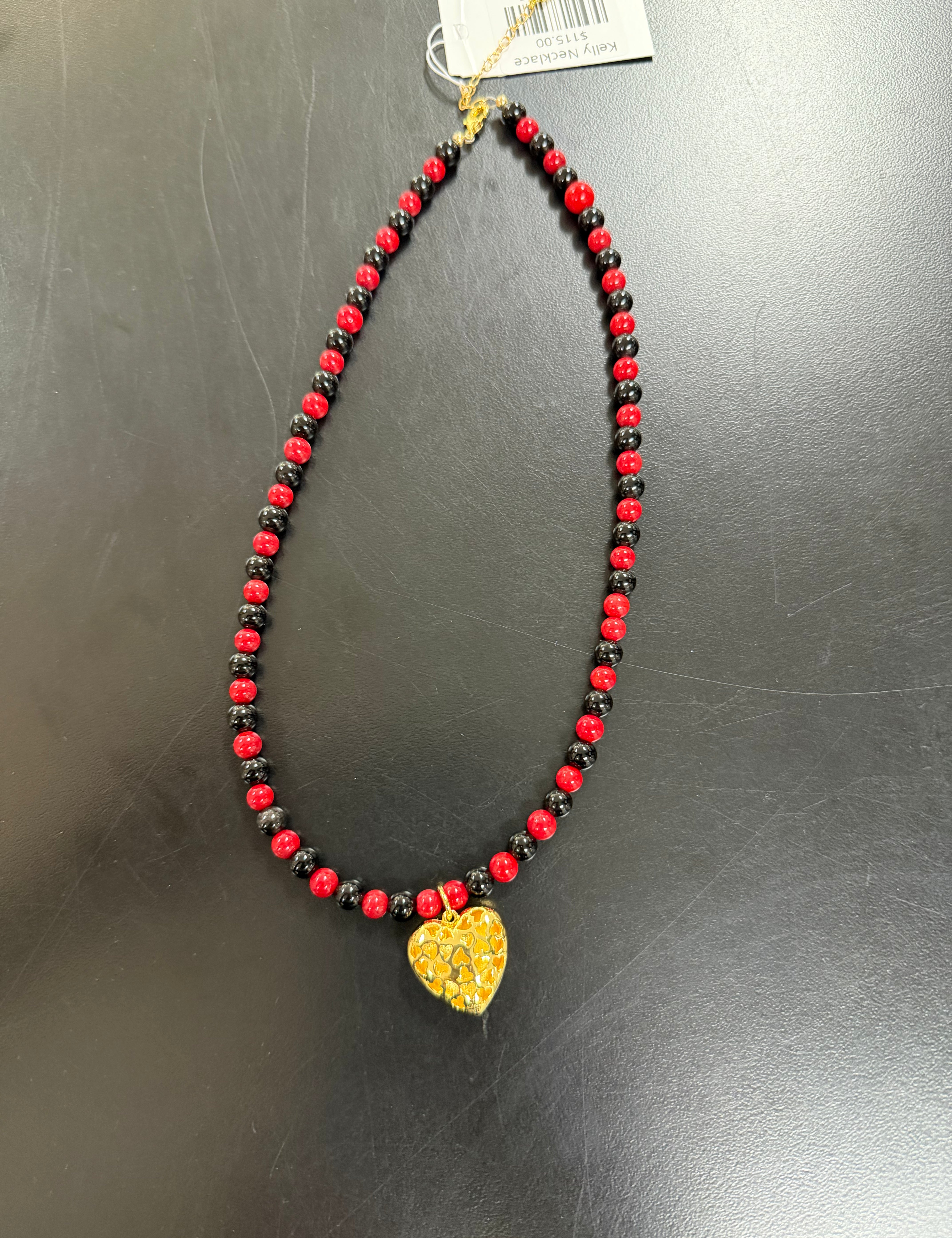 a necklace with a heart pendant