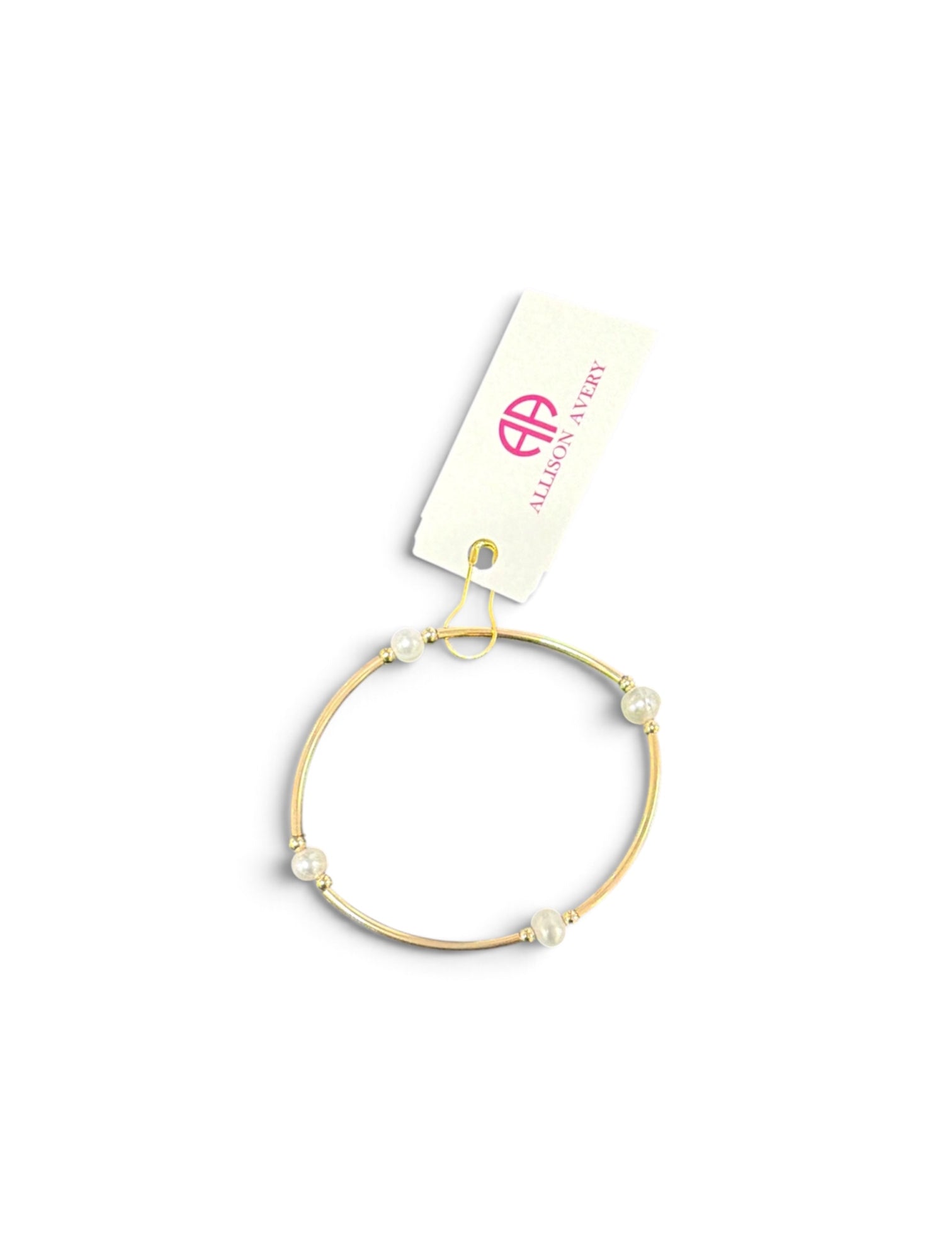 a gold bracelet with pearls on it