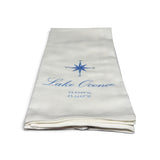 a folded white towel with blue text