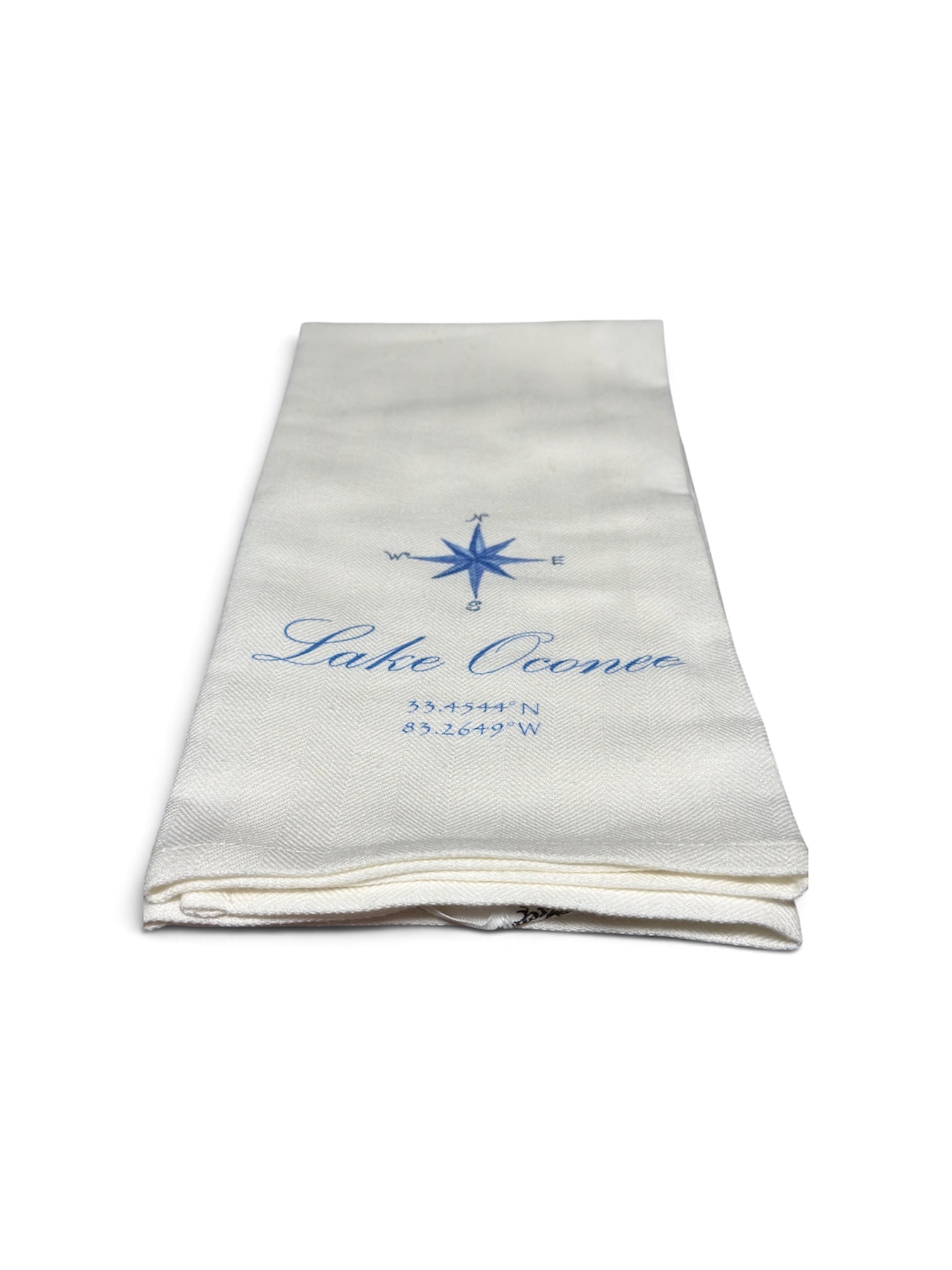a folded white towel with blue text