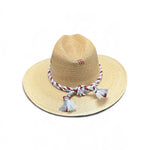 a straw hat with tassels