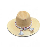 a straw hat with tassels