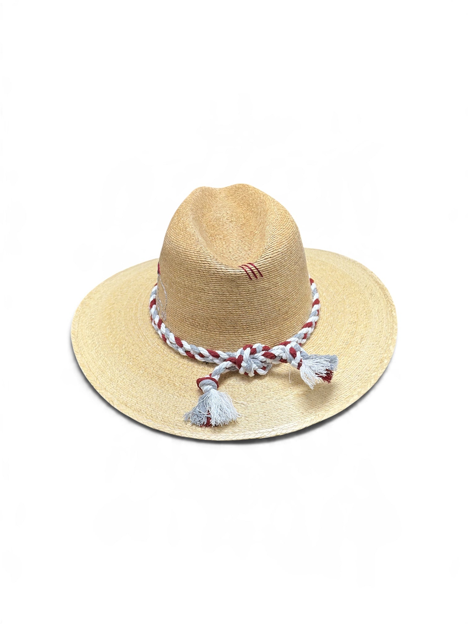 a straw hat with tassels