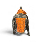 a jacket with orange patch on it