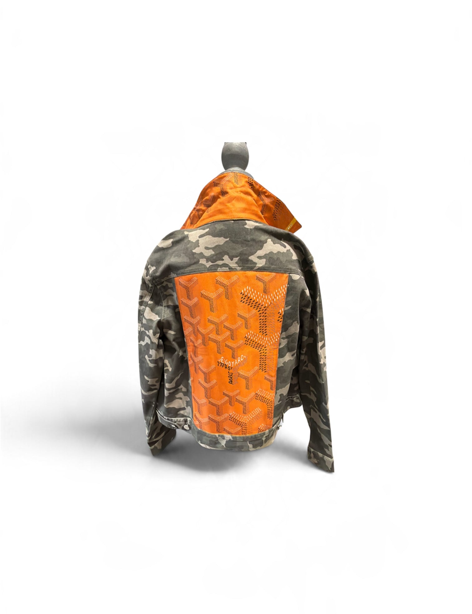 a jacket with orange patch on it