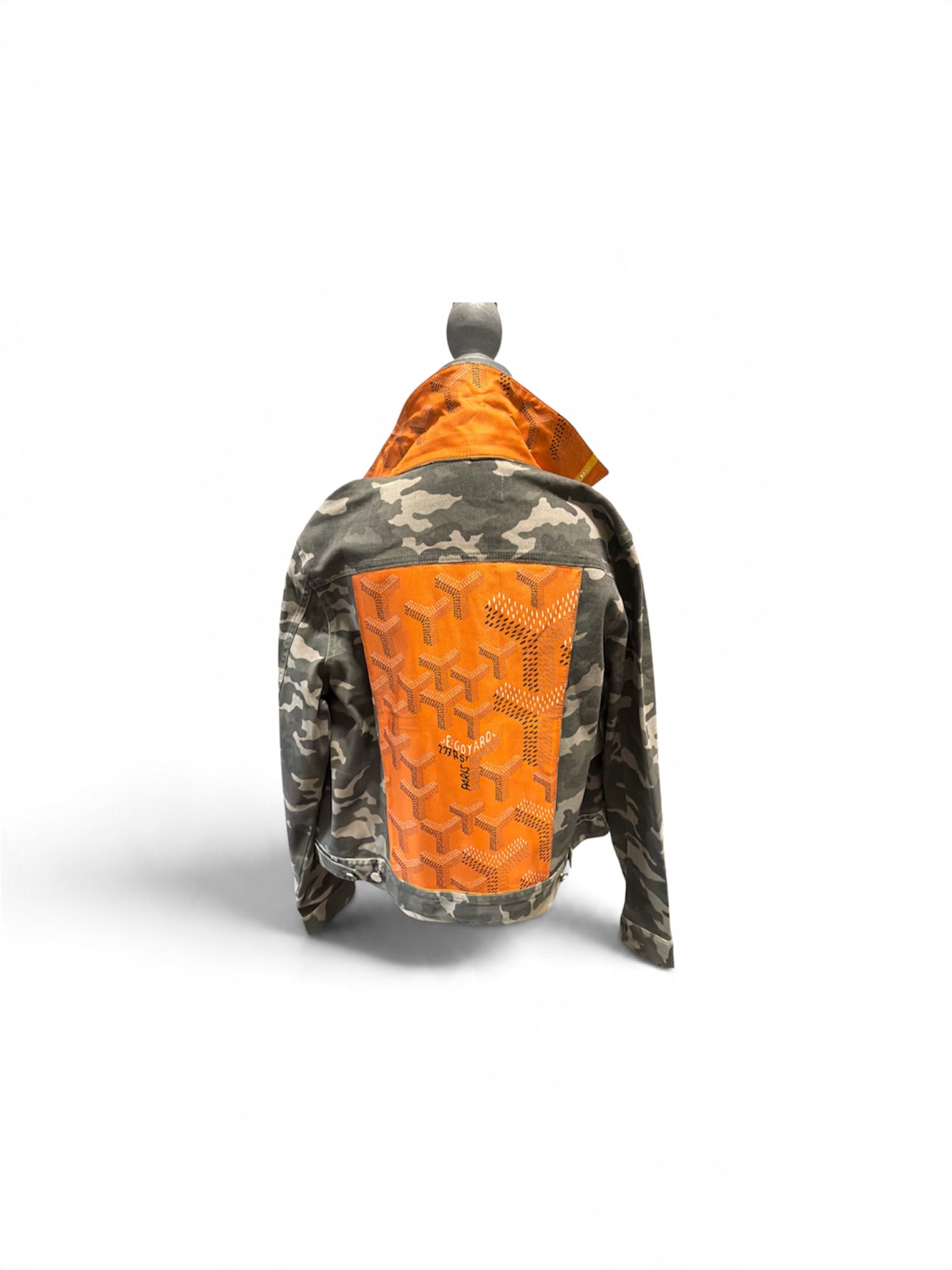 a jacket with orange patch on it