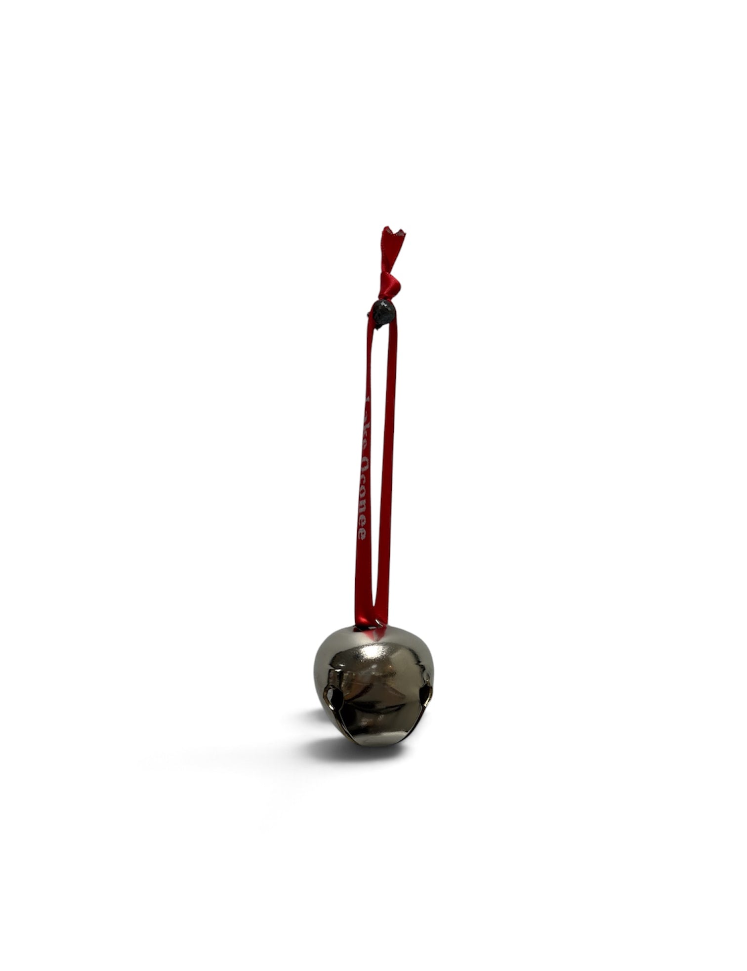 a silver bell with a red string